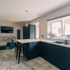 Photo 10: Communal Kitchen and Living Area