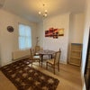 Photo 2: the ground floor dining room