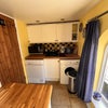 Photo 8: Small kitchen with combo microwave/oven, fridge, washing machine and tumble dryer