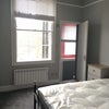 Photo 6: bedroom with door leading to shower room