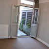 Photo 8: Downstairs room has garden access