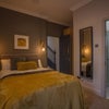 Photo 3: Bedroom 2, ground floor. Fully furnished, private en-suite, double doors directly to the garden