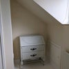 Photo 7: Desk. It can go if you need the space. Plenty of space at this end for a yoga mat.