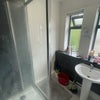 Photo 4: Shower and sink