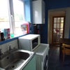 Photo 4: Utility room with living room behind