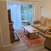 Photo 2: The living room has patio doors through to the back garden