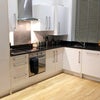 Photo 1: Kitchen/ Living Space