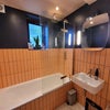 Photo 4: Shared bathroom. Great shower. 
