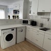 Photo 6: Open Kitchen with washer dryer 