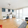 Photo 4: shared living room with balcony 