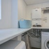 Photo 6: Utility room with washing machine and dryer