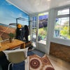 Photo 5: Communal room leading to garden