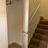Photo 5: Storage cupboard in hall