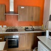 Photo 6: shared kitchen TV room