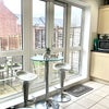 Photo 2: Kitchen with seating area