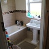 Photo 9: Shared bathroom on first floor.