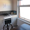 Photo 5: Communal kitchen with oven and hob 