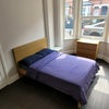 Photo 4: Fully furnished with bed frame and mattress, black-out curtains and loads of storage