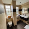 Photo 8: Tiled bathroom 