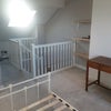 Photo 2: Behind the stairs, under the sky light, there is loads of storage space.