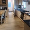 Photo 2: Kitchen through to laundry room