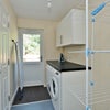 Photo 4: Utility Room with Washing Machine, Dryer and Clothes Airer