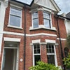 Photo 2: Front of house, lovely Victorian red brick, new windows