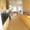 Photo 1: Kitchen with Dining Table and Garden Access