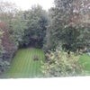 Photo 9: Lovely long back garden.  Parking in front.