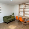 Photo 2: dining and work area with sofa bed