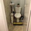 Photo 6: Toilet with face basin and mirror. 