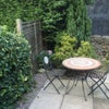 Photo 8: Table and chairs on patio area in garden