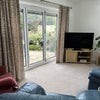 Photo 2: Lounge with patio doors