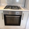 Photo 3: Electric oven and gas hob