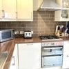 Photo 11: Fully equipped kitchen with everything you need.