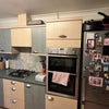 Photo 6: Oven and shared fridge