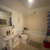Photo 6: Shared bathroom with shower in the bath