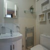 Photo 6: Private en-suite bathroom with high pressure shower, basin, under cabinet storage, toilet