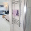 Photo 6: Walk in shower with Bi Fold door, WC & Basin