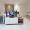 Photo 9: Screening curtains for room partition, unit swivels for watching TV in bed.