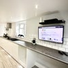 Photo 11: Open plan communal kitchen and lounge
