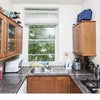 Photo 6: Modern kitchen with stove, oven, micro-wave and fridge/freezer