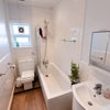 Photo 9: Shared with three people this brand new bathroom is the perfect pamper spot