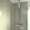 Photo 4: shared bathroom with shower and bath