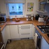 Photo 2: Kitchen with many appliances, air fryer, washer/dryer, etc