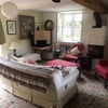 Photo 3: sitting room with stove, piano and TV