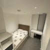 Photo 2: Bedroom (Furnished with Double Bed, Table and Storage)