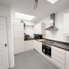 Photo 4: Kitchen (door to left is boiler cupboard)