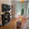 Photo 1: Living room, looking towards front window