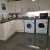 Photo 8: Kitchen with washing Machine and tumble dryer